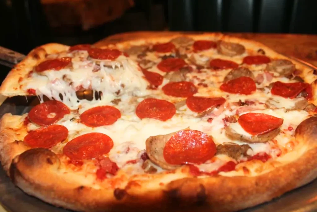 Freshly baked pizza with melted cheese and pepperoni toppings